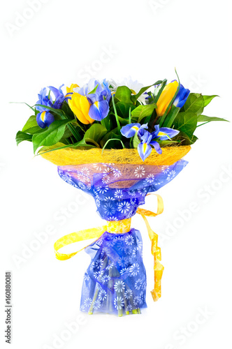 Beautiful bouquet with tulips and irises on white background