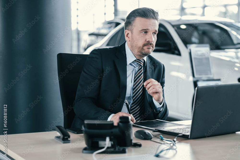 Top sales manager at dealership showroom Top sales manager at dealership showroom
