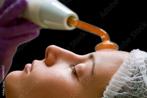 Beauty treatment of face skin with high frequency infrared spot remover in SPA center photo