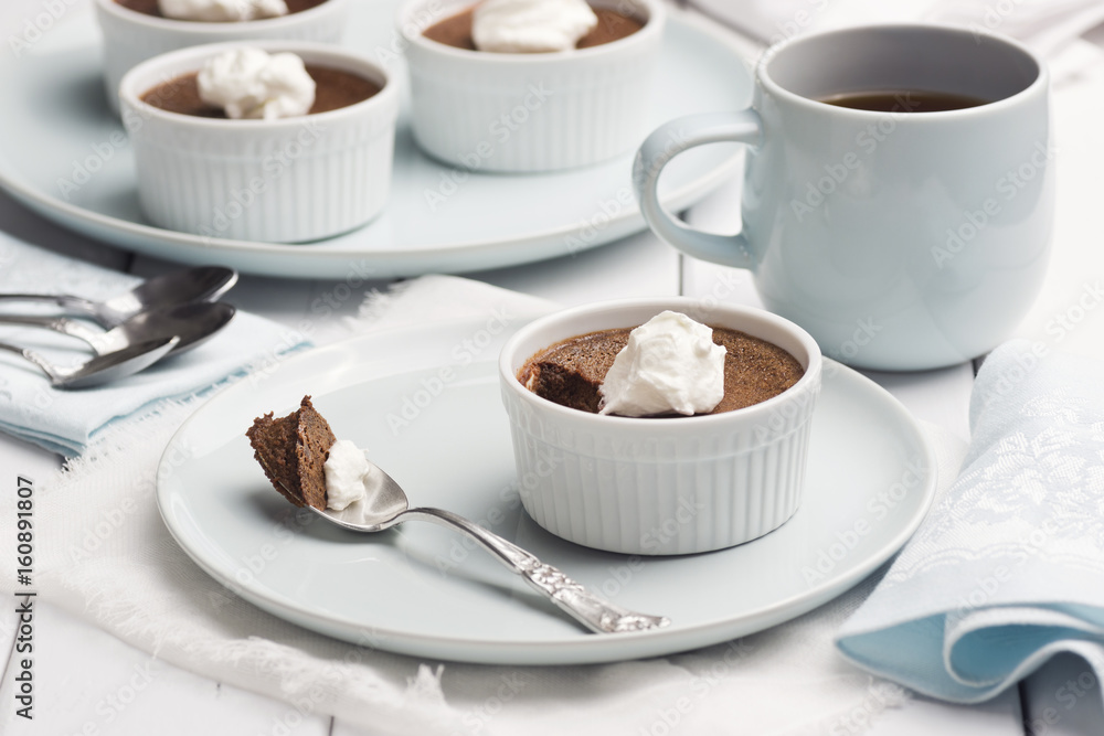 Ramekins of Chocolate Pot De Creme with Whipped Cream and Mug of Coffee Ramekins of Chocolate Pot De Creme with Whipped Cream and Mug of Coffee