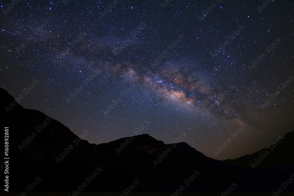 Fototapeta premium Beautiful milky way galaxy over moutain on a night sky before sunrise.