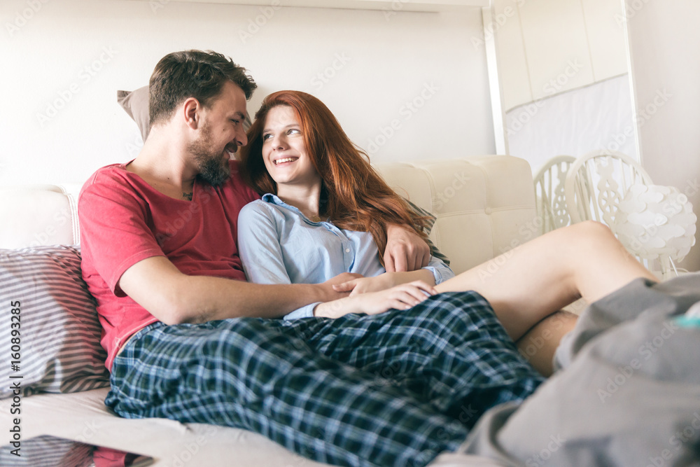 Young couple hugging at home Young couple hugging at home