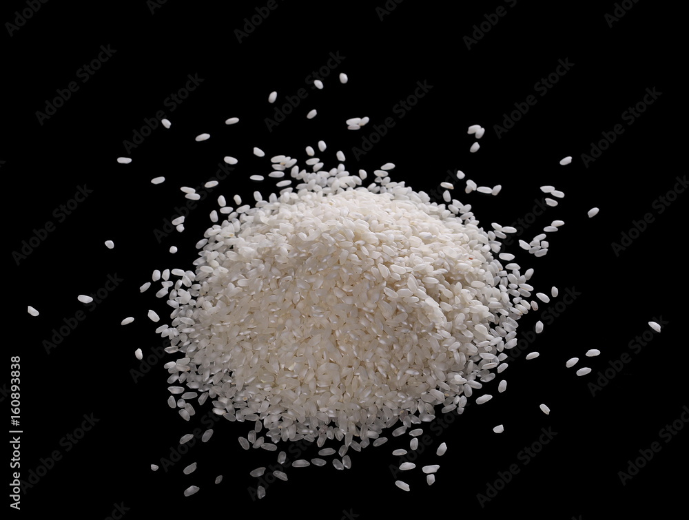 White rice pile isolated on a black background White rice pile isolated on a black background