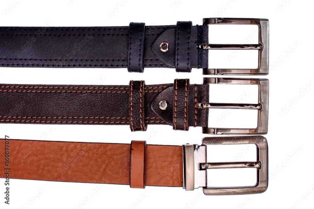 Several fashionable male belts red gray brown isolated on white background Several fashionable male belts red gray brown isolated on white background