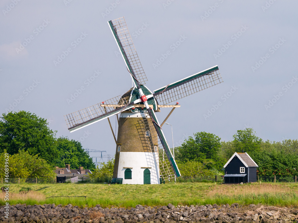 Windmill on dike of Spui river in Nieuw-Beijerland, Netherlands