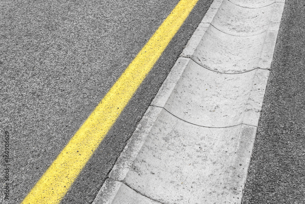 Fototapeta premium Drain channel on the asphalt road.