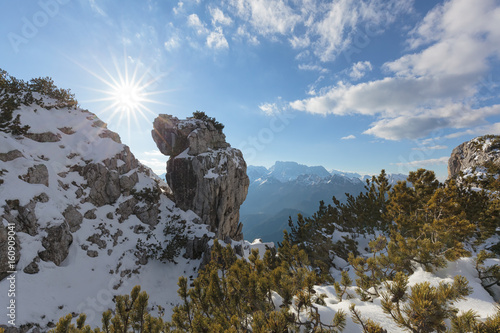 Europe, Italy, Veneto, Belluno, Agordino, Dolomites, Palazza Alta. Curious rock formation in the mountains between pristine snow and shrubs of mugo pine photo