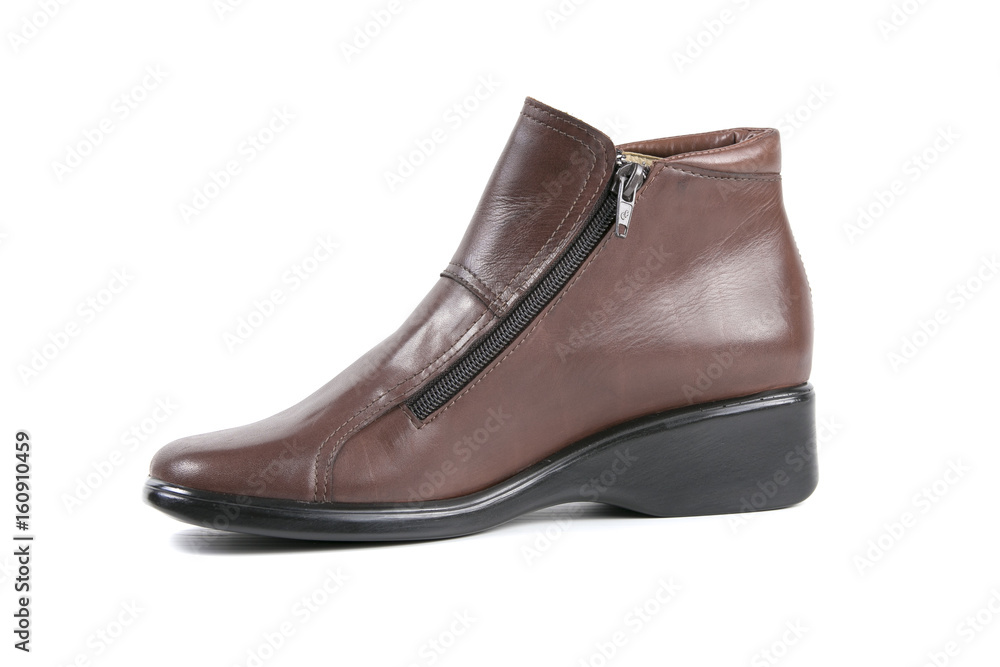 Female Brown Boot on White Background, Isolated Product, Top View, Studio. Female Brown Boot on White Background, Isolated Product, Top View, Studio.