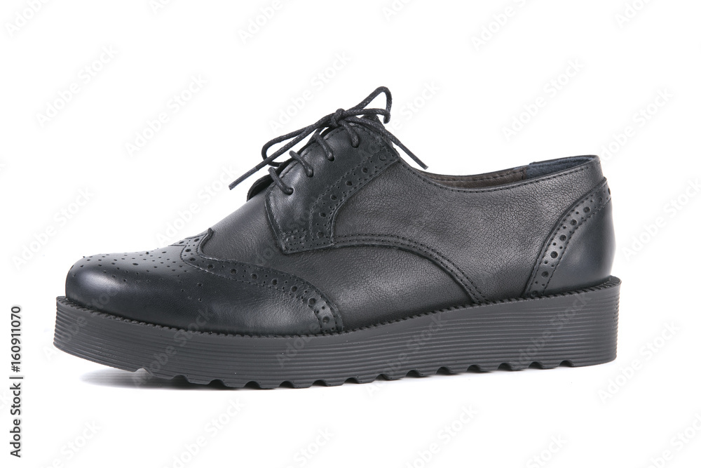 Black Shoe on White Background, Isolated Product, Top View, Studio. Black Shoe on White Background, Isolated Product, Top View, Studio.