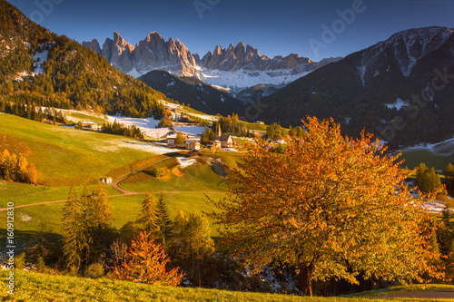 Sankta Magdalena at Sunset in Funes valley, Odle Natural park in Trentino Alto Adige district, Italy, Bolzano province, Europe. photo