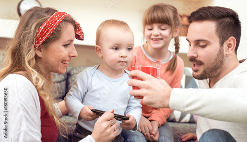 Happy young family at home