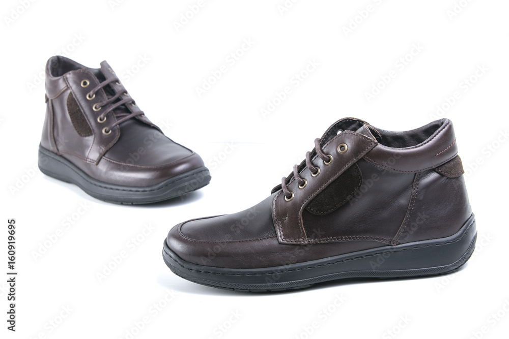 Brown Boot on White Background, Isolated Product, Top View, Studio. Brown Boot on White Background, Isolated Product, Top View, Studio.