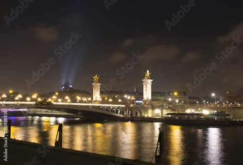 Night view of Grand Palais (Palace), Pont Alexandre III bridge and and Seine river in Paris. © theendup