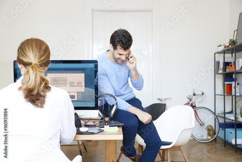 Young creative male managing his business