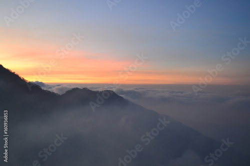 sunset over the clouds in mountain
