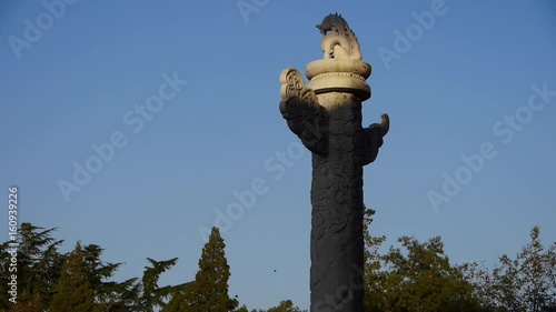east ancient royal lion marble pillar in Beijing China. photo