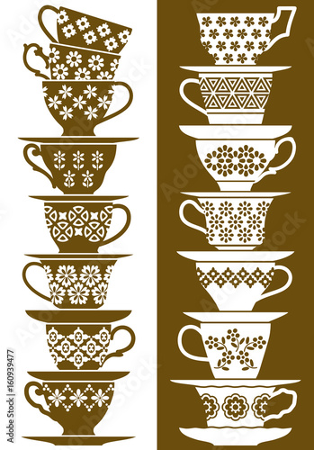 Plain colored piles of cups and saucers with different decorations and shapes