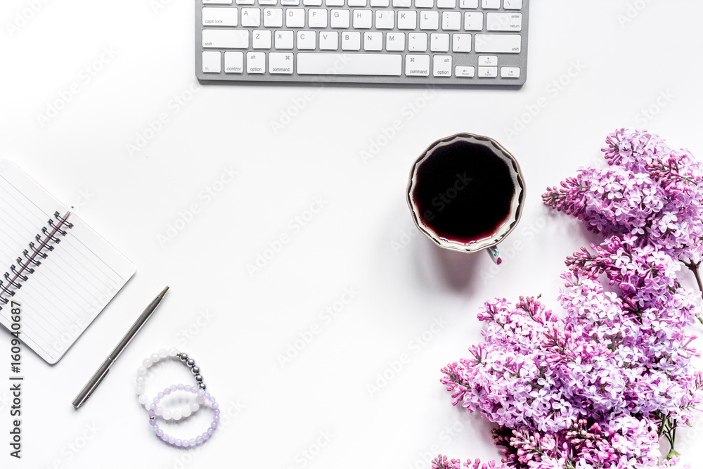 work place with lilic flowers and coffee for woman on white desk background top view mock-up work place with lilic flowers and coffee for woman on white desk background top view mock-up