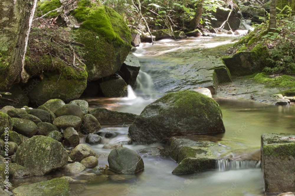 Beautiful waterfall with moss on the stones in the woods. Beautiful waterfall with moss on the stones in the woods.