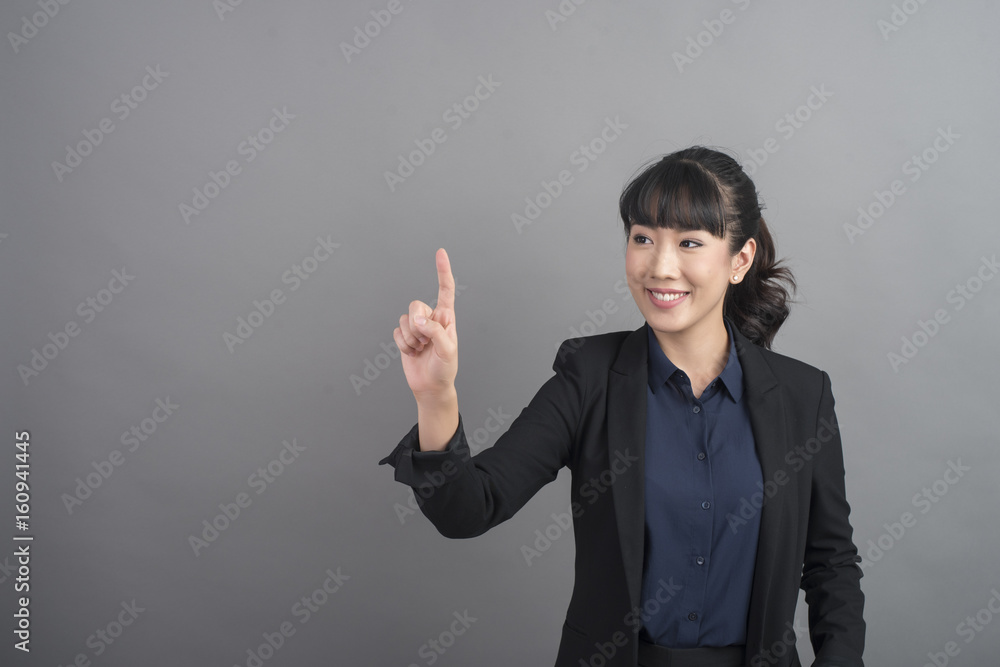 Beautiful Business Woman touching on grey background Beautiful Business Woman touching on grey background