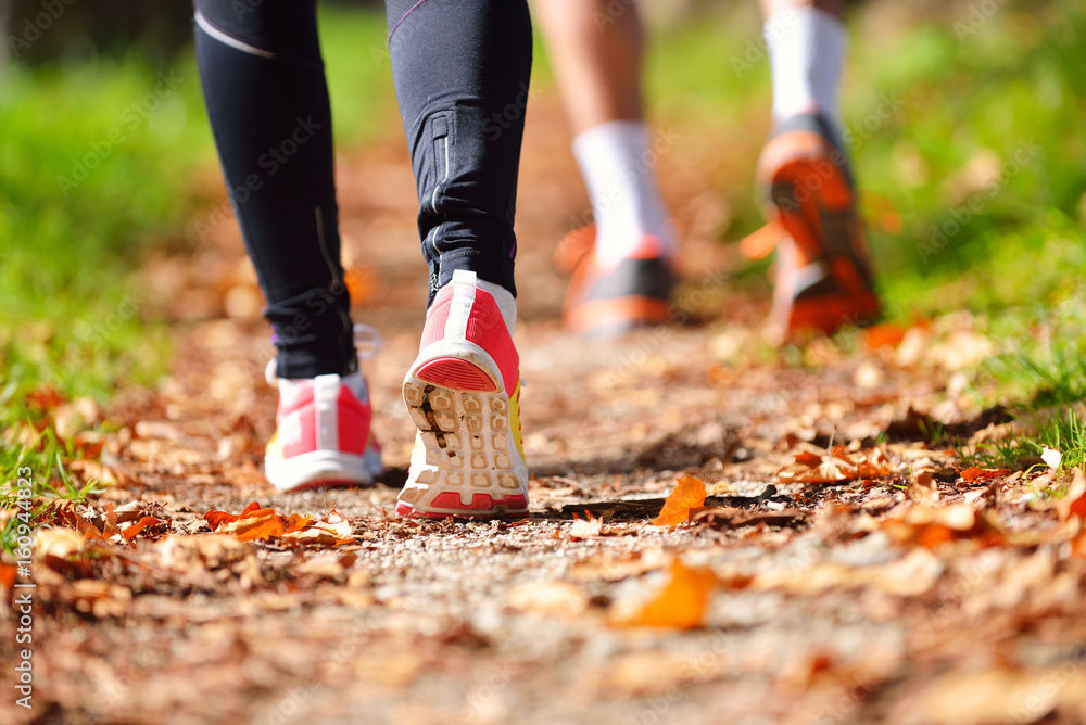 Young couple jogging in park at morning. Health and fitness. Young couple jogging in park at morning. Health and fitness.