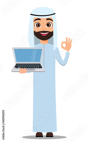 Arab man in white clothes. Cute cartoon character showing OK sign and holding laptop. Vector illustration