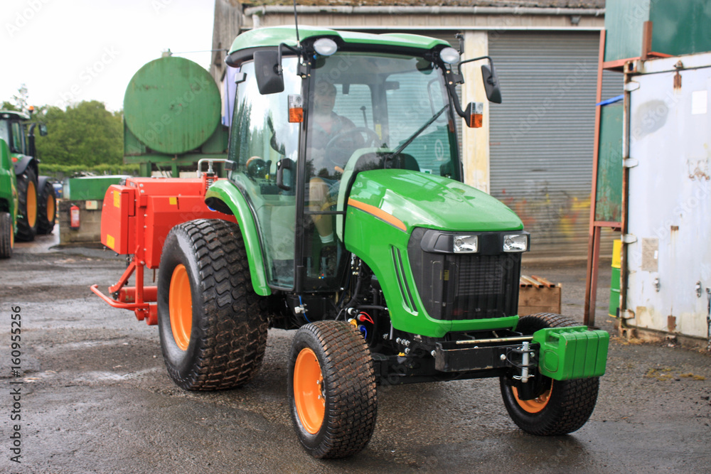 tractor in a farmyard