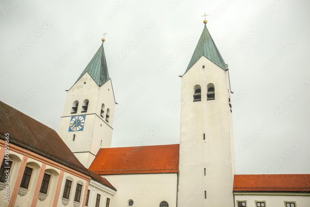 Obraz premium A view of the belfry of romanesque basilica Saint Mary and Corbinian Cathedral in Freising, Germany.