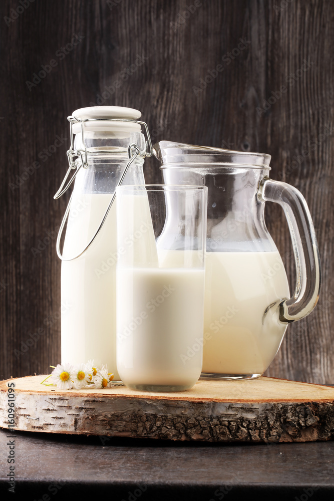 Milk jug and glass milk - healthy lifestyle concept Milk jug and glass milk - healthy lifestyle concept