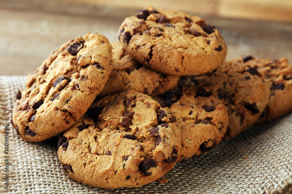 Chocolate cookies on wooden table. Chocolate chip cookies shot Chocolate cookies on wooden table. Chocolate chip cookies shot