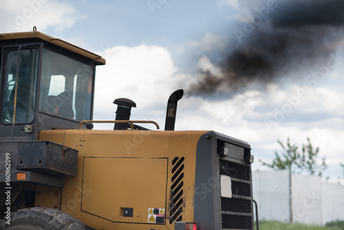 Tractor exhaust pipe. dirty black exhaust. Pollution of the environment. the diesel exhaust. carbon monoxide