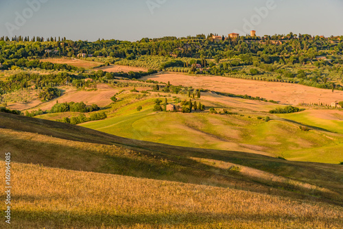 Idyllic panorama of the valley of the orcia in tuscan province of siena in summer with cultivated fields photo