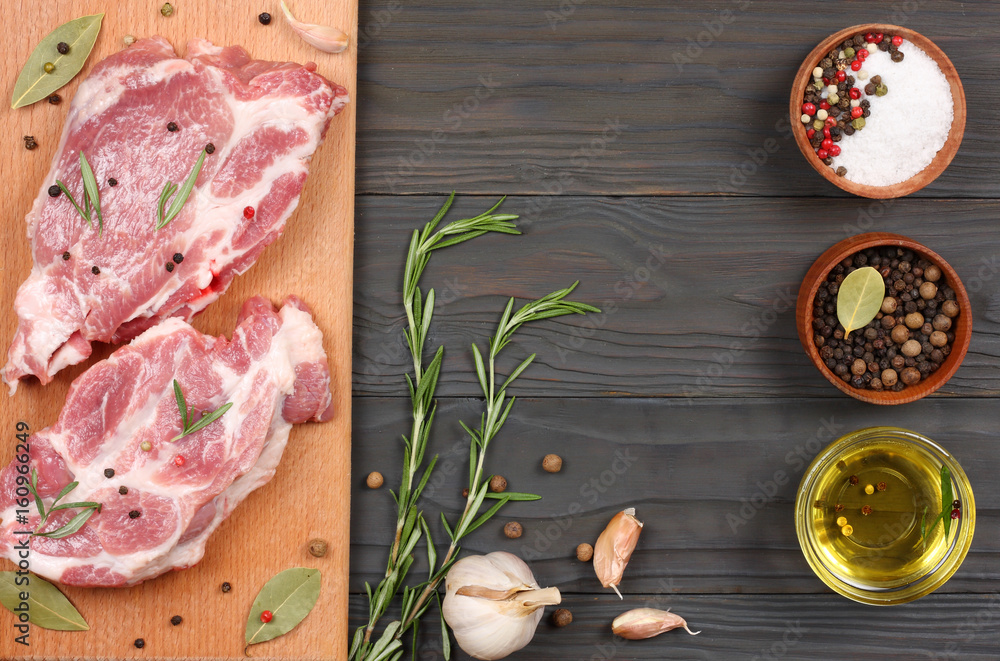 fresh raw meat with spices on wooden table. top view with copy space fresh raw meat with spices on wooden table. top view with copy space