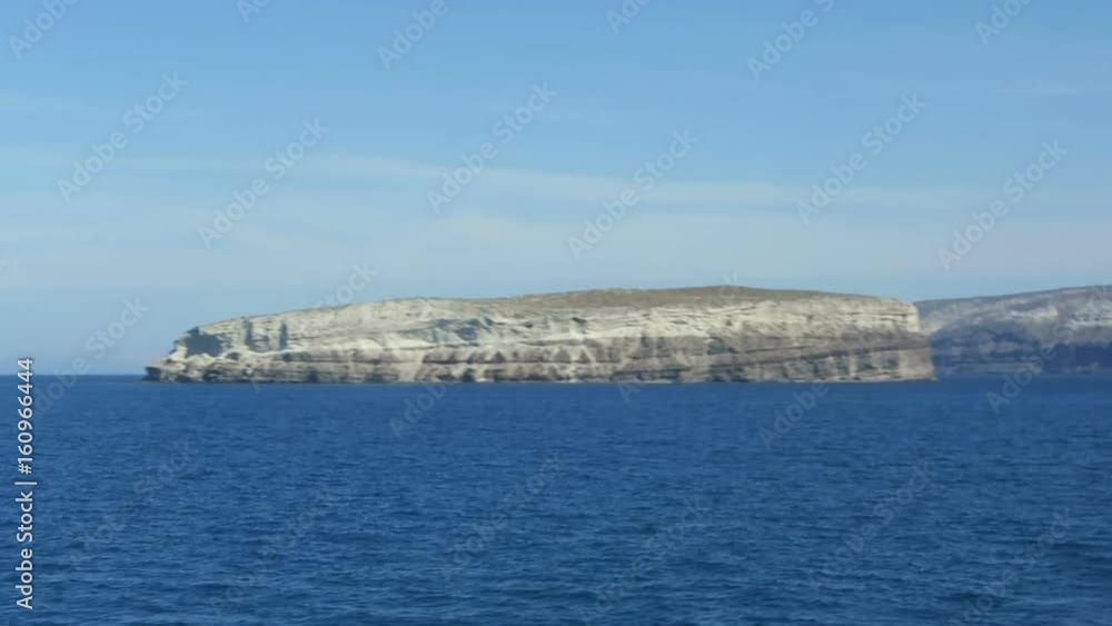 reaching Santorini isle with a ferry from crete. (Greece). driving into the caldera. reaching Santorini isle with a ferry from crete. (Greece). driving into the caldera.