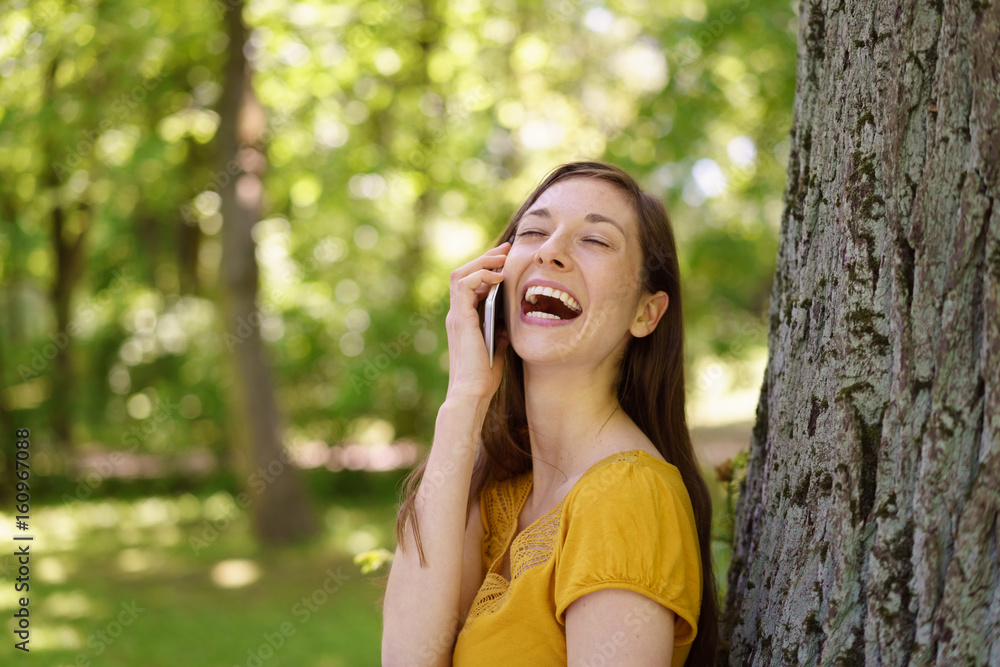Pretty young woman enjoying a good joke Pretty young woman enjoying a good joke