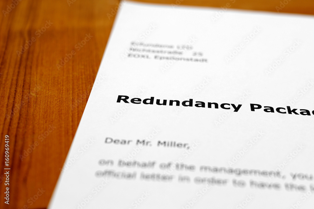 Obraz premium A letter on a wooden table - redundancy package