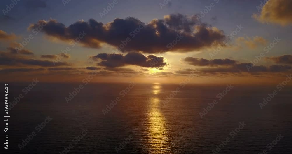 Brightly colored sunset over the calm Mediterranean Sea. Drone Point of View . Night Brightly colored sunset over the calm Mediterranean Sea. Drone Point of View . Night