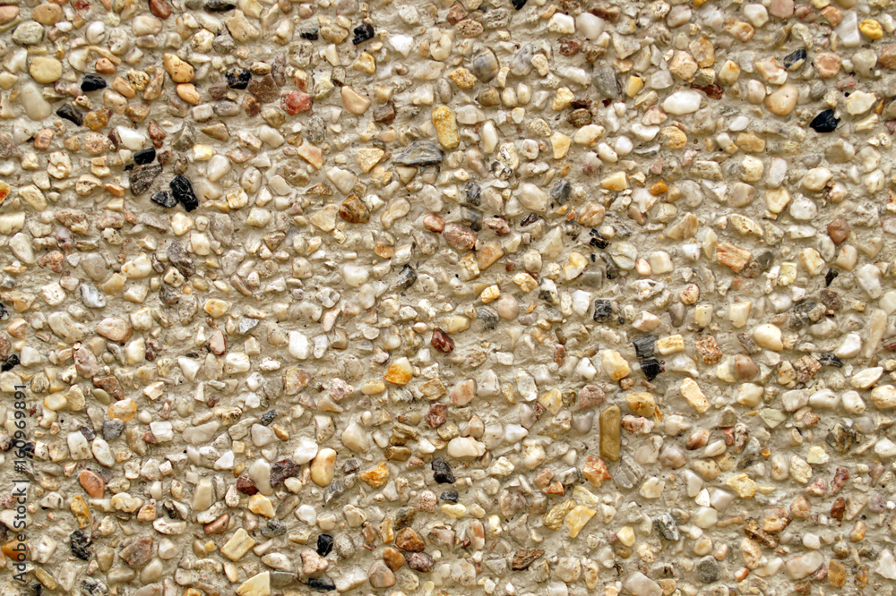 Multi colors small stones wall background.