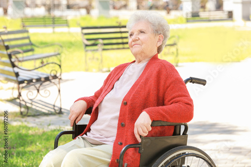 Disabled elderly woman in w...