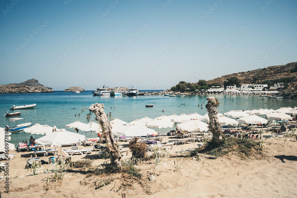 Lindos, Greece - Septemeber 10, 2016: View of the beach town of Lindos, with yachts and blue sea