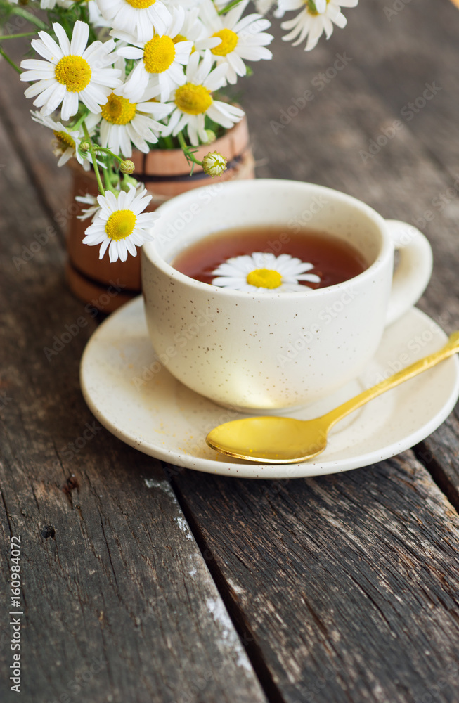 cup of herbal chamomile tea with camomile dry blossoms, dried camomile flowers. doctor treatment and prevention of immune concept, medicine - folk, alternative, complementary, traditional medicine cup of herbal chamomile tea with camomile dry blossoms, dried camomile flowers. doctor treatment and prevention of immune concept, medicine - folk, alternative, complementary, traditional medicine