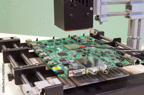 Replacing the microprocessor in bga rework station. Infrared soldering station in operation