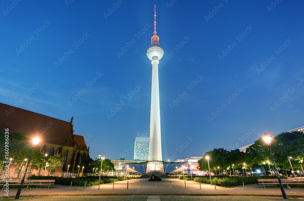 BERLIN -AUGUST 18, 2015: Alexanderplatz at night on OAugust 18, 2015 in Berlin, Germany. It's a large public square and transport hub in the central Mitte district of Berlin, near the Fernsehturm.
