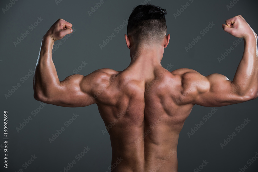 muscular man with muscle torso showing biceps and triceps