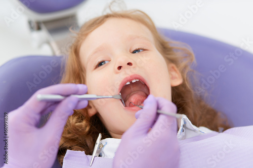 Close-up little girl at dentist