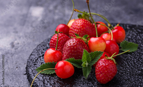 Fresh ripe strawberry and cherry