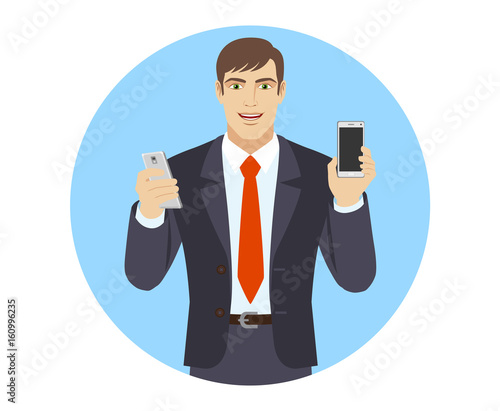 Businessman with two mobile phones