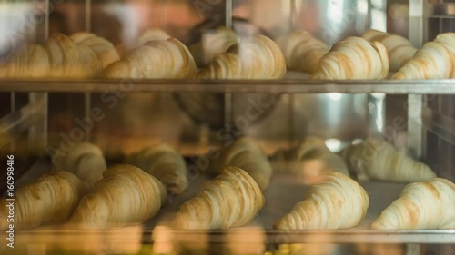 Classic French croissant are baking in the oven. Time lapse shot. 4k. Breakfast time. Background.