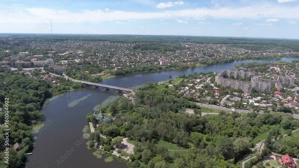 Aerial View. Flying over the city and bridge over the river Aerial View. Flying over the city and bridge over the river