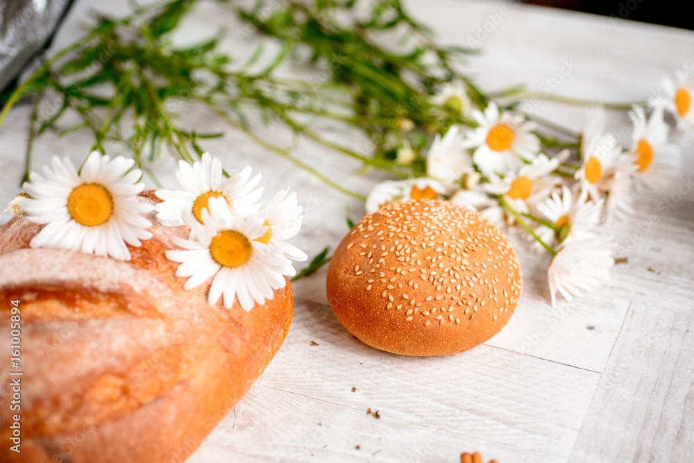 cracker, cookie, biscuit, chamomile flowers on a wooden table.